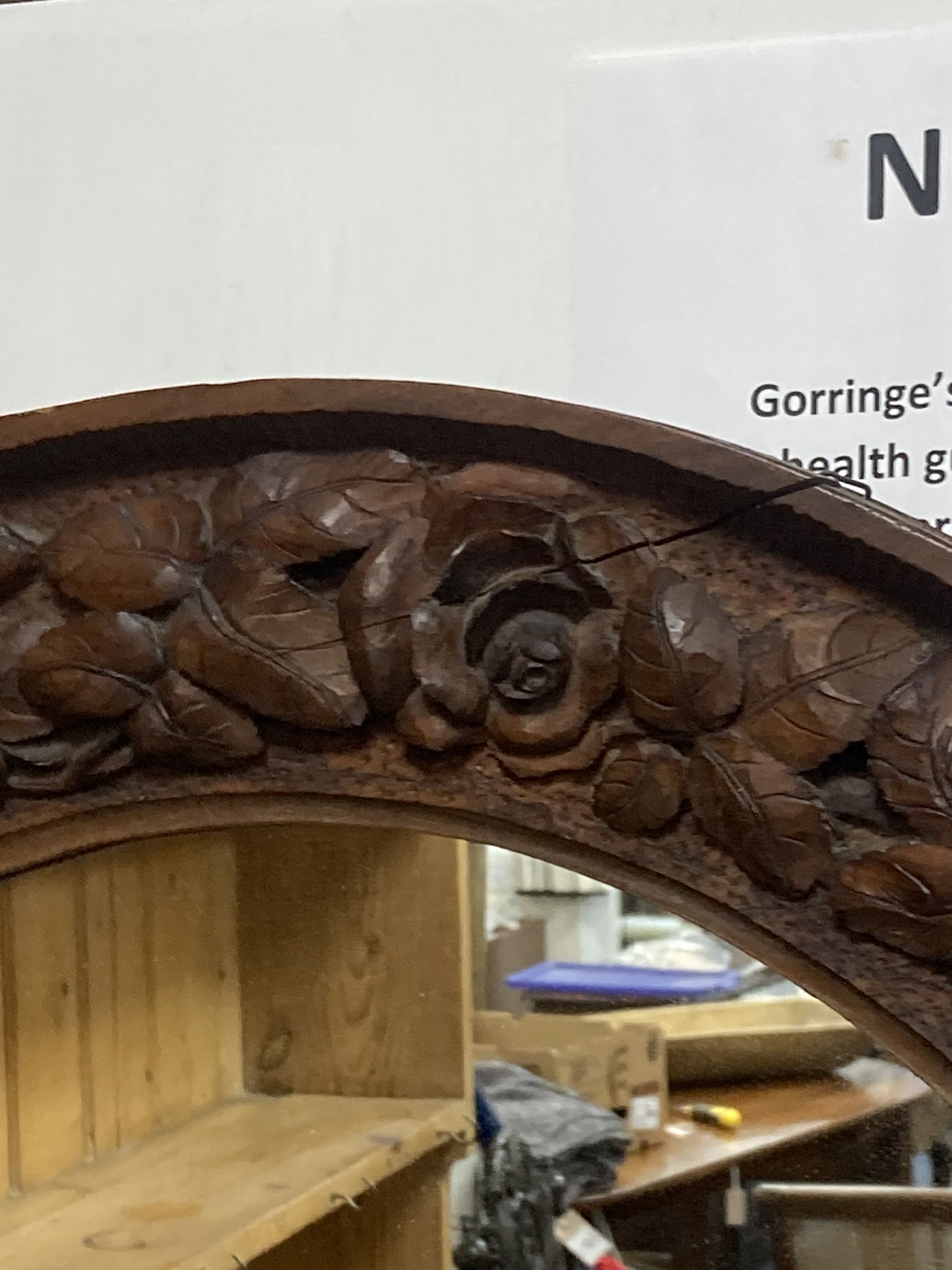 A carved wood circular wall mirror, diameter 56cm